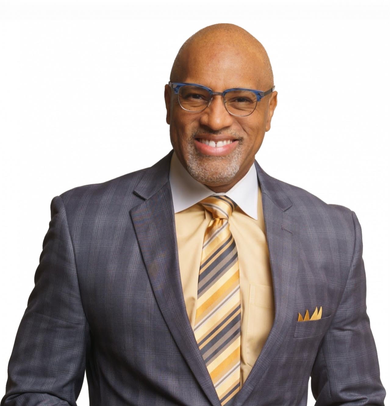 Portrait of Dr. Nos in a gray suit and gold tie